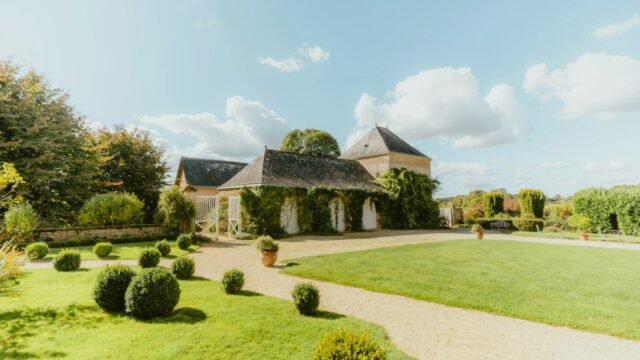 Ivy-covered French countryside chateau estate with manicured gardens — romantic French wedding venue
